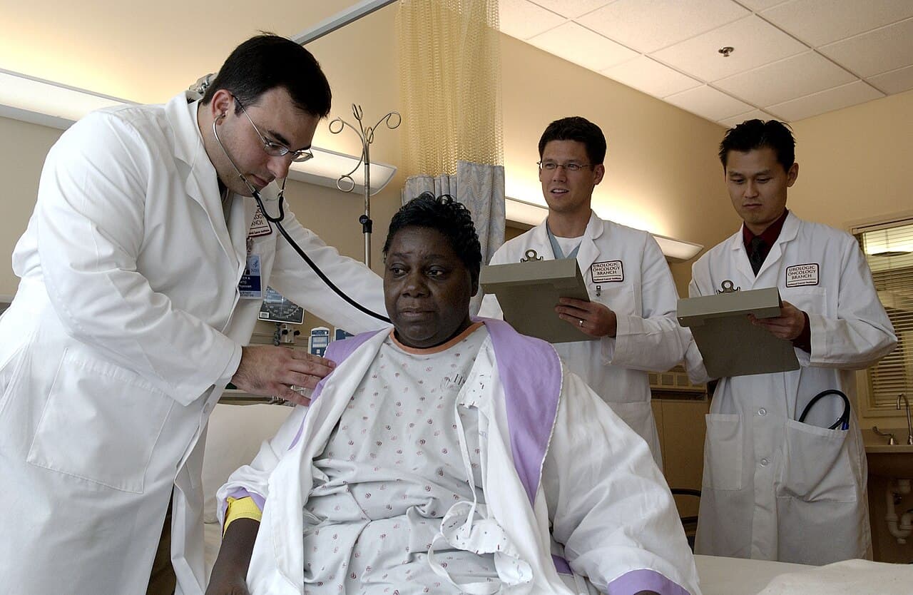 A doctor examining a patient with a stethoscope