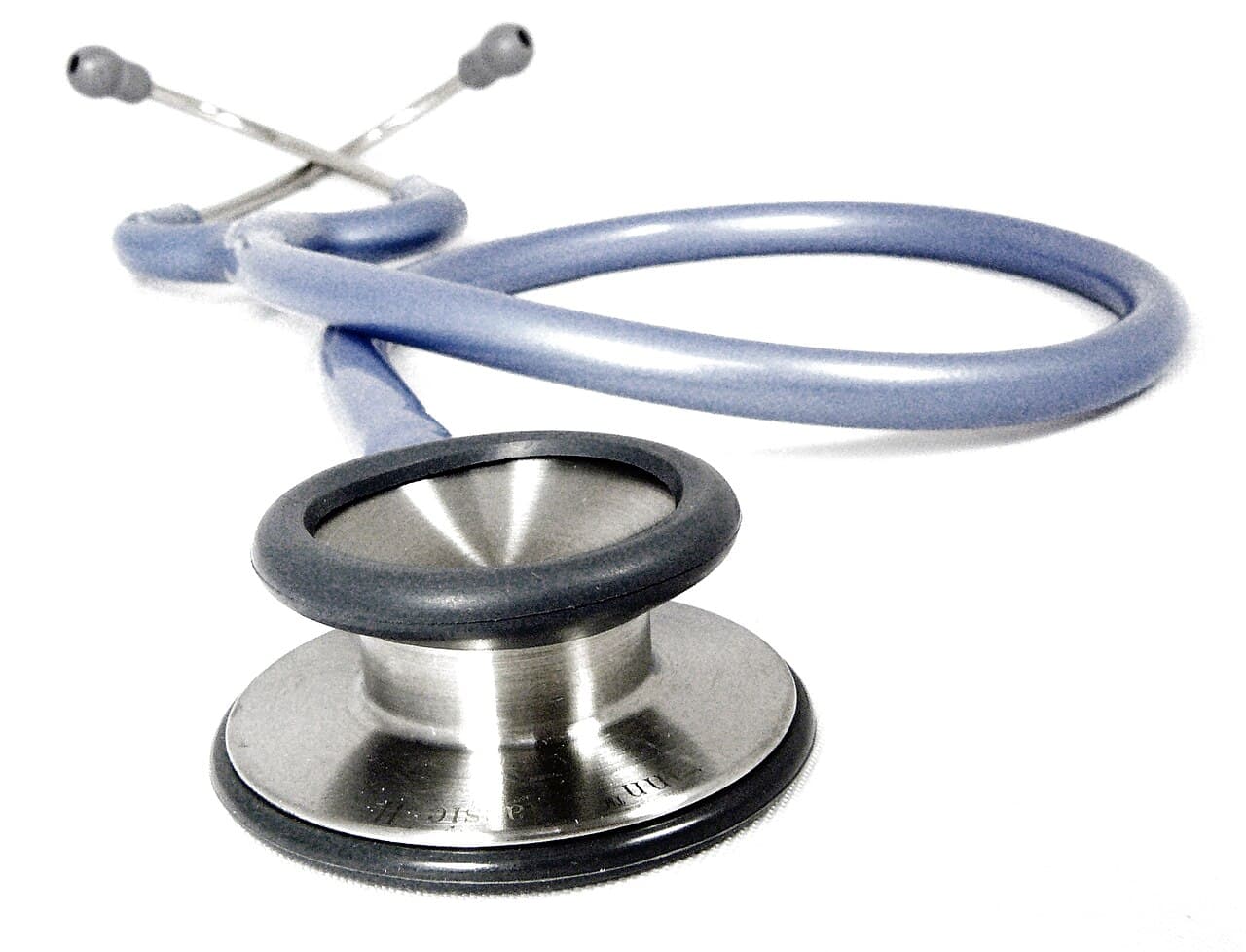 Stethoscope on a wooden desk in a consulting room